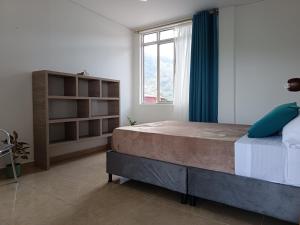 Ένα ή περισσότερα κρεβάτια σε δωμάτιο στο Panorama Café Hostel +10 φωτογραφίες