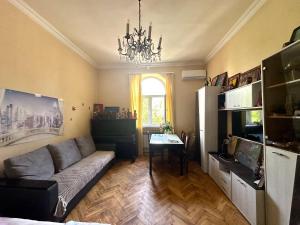 a living room with a couch and a table at KAR-SON family guesthouse & Tours in Yerevan