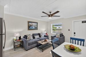 a living room with a couch and a table at Sunset Beach Suites Unit 4 in St. Pete Beach