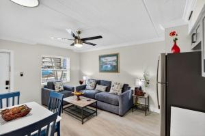 a living room with a couch and a table at Sunset Beach Suites Unit 3 in St. Pete Beach