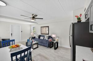 a kitchen and living room with a couch and a table at Sunset Beach Suites Unit 1 in St. Pete Beach
