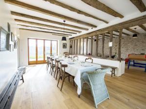 a large dining room with a long table and chairs at Grande Maison avec terrasse et proche rivière en Berry - FR-1-591-13 in Badecon-le-Pin