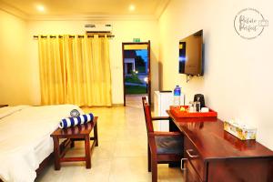 TV a/nebo společenská místnost v ubytování The Haven Sun N' Fun Hotel