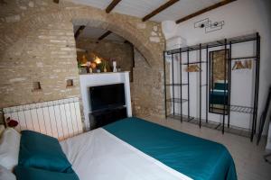 Ένα ή περισσότερα κρεβάτια σε δωμάτιο στο Dimora del tufo