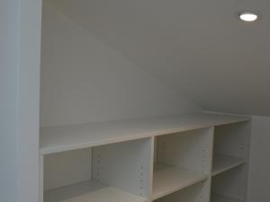 a white shelf in a closet with a light on it at Gîte rénové, 35 min de Nancy, près de châteaux, fibre, parking privé, idéal famille - FR-1-584-169 in Vroncourt +2 photos