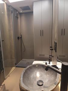 a bathroom with a sink and a shower at Apt Design a Campiglio 400m funivie in Madonna di Campiglio +27 photos