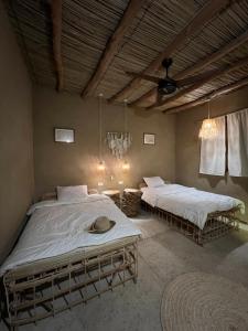 Ένα ή περισσότερα κρεβάτια σε δωμάτιο στο Gamandy Eco-Lodge