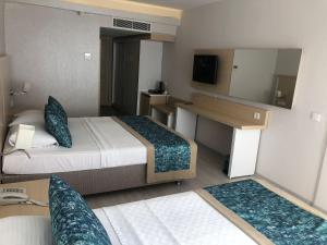 Postel nebo postele na pokoji v ubytování Pirates Park Resort - All Inclusive + 27 fotografií