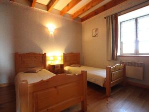 Ένα ή περισσότερα κρεβάτια σε δωμάτιο στο Maison de charme XVIIIe sur chemin St-Jacques, proche Le Puy-en-Velay, idéale familles et randonneurs - FR-1-582-298