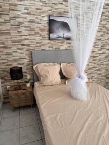 Ένα ή περισσότερα κρεβάτια σε δωμάτιο στο Le Confort Double