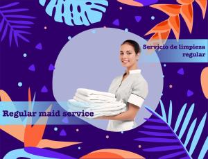 a woman in a white uniform holding a tray of towels at PLAZA DUCASSI-SUITES AND STUDIOS- playa LOS CORALES in Punta Cana