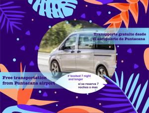 a white van parked on a road next to a tree at PLAZA DUCASSI-SUITES AND STUDIOS- playa LOS CORALES in Punta Cana +44 photos