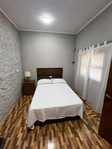 Postel nebo postele na pokoji v ubytování El Quincho