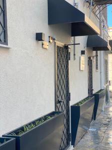 a building with benches on the side of it at Luxury Royal House 3 in Palermo