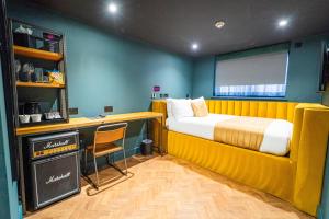 a room with a bed and a desk with a chair at Duke Street Boutique Hotel in Liverpool