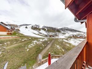 a view of a snow covered mountain from a house at Appartement cosy 6 pers au pied des pistes - FR-1-807-1 in Saint-François-Longchamp
