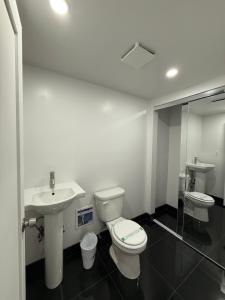 a bathroom with a toilet and a sink at 31 Street Broadway Hotel in New York +253 photos