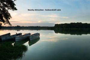 two boats sitting in the water on a lake at Hotel O Eagle Fantasy in Vānivilāsa Puram