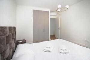 Ένα ή περισσότερα κρεβάτια σε δωμάτιο στο Aqua Lux Apartment BW