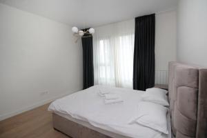 Ένα ή περισσότερα κρεβάτια σε δωμάτιο στο Aqua Lux Apartment BW