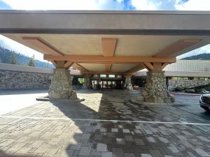 a covered parking lot with a car parked under it at 6th Floor Fireplace Suite in Tahoe City