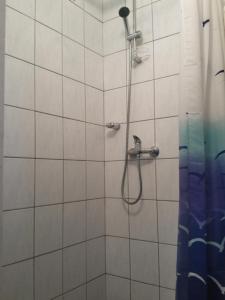 a bathroom with a shower with a shower curtain at Guest House Željko Klarić in Skradin +44 photos