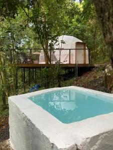 a small swimming pool in front of a tent at Indómito Domes at El Yunque Zone in Canovanas