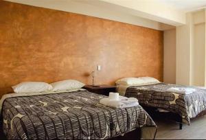 Postel nebo postele na pokoji v ubytování Hotel Sky - Tarija