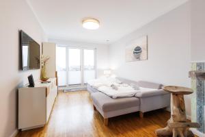 Ένα ή περισσότερα κρεβάτια σε δωμάτιο στο PrimeLoft "Frische Brise" - Penthouse - Fahrstuhl - modern & geräumig - Familien - Dachterasse - Tiefgarage