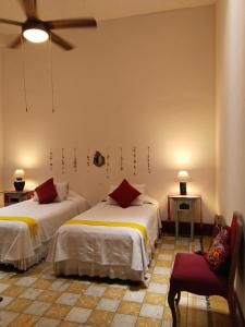 Postel nebo postele na pokoji v ubytování El Diablo y la Sandia B&B