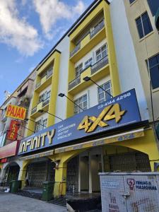 a building with a sign on the front of it at Swing & Pillows - Setapak Central, Kuala Lumpur in Kuala Lumpur