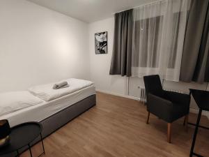 En eller flere senge i et værelse på Waldblick Suite 100 qm