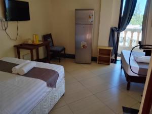 Ένα ή περισσότερα κρεβάτια σε δωμάτιο στο Darad Diani Hotel