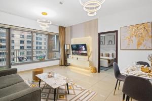 a living room with a couch and a table at White House With Burj Views, Free Parking in Dubai