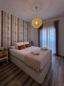 Ένα ή περισσότερα κρεβάτια σε δωμάτιο στο Dos Mundos