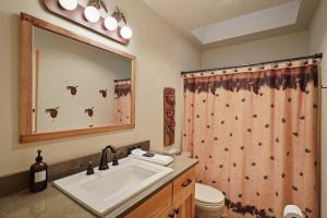 a bathroom with a sink and a toilet at 14 Mt Hood in Sunriver +32 photos