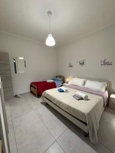 a bedroom with two beds in a room at Appartament house in Marcianise +40 photos