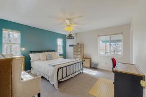 a bedroom with a bed and a ceiling fan at Recreational Paradise in Gunnison