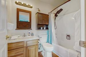 a bathroom with a toilet and a sink and a shower at Recreational Paradise in Gunnison +10 photos