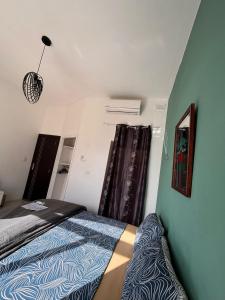 a bedroom with a bed and a window at Next to beach Sliema Stay, Cozy, Air-Conditioned, Self Check-In in Il-Gżira
