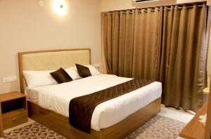 Voodi või voodid majutusasutuse Lavender Airport suite toas