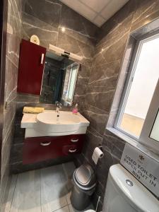a bathroom with a sink and a toilet at Next to beach Sliema Stay, Cozy, Air-Conditioned, Self Check-In in Il-Gżira