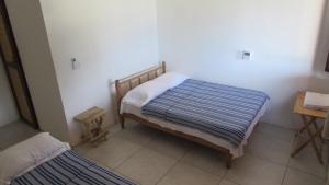 Un pat sau paturi într-o cameră la La Casa Del Profe Salo +48 fotografii