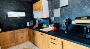 Η κουζίνα ή μικρή κουζίνα στο Pensiunea Codru +6 φωτογραφίες