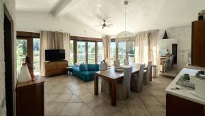 a living room with a blue couch and a table at Adriatic Lifestyle Apartment in Stari Grad