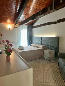 Ένα ή περισσότερα κρεβάτια σε δωμάτιο στο Il Casale della Baronessa