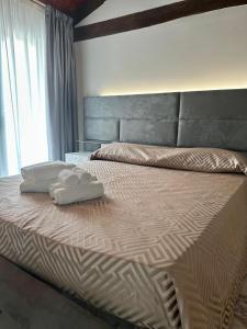 Ένα ή περισσότερα κρεβάτια σε δωμάτιο στο Il Casale della Baronessa