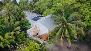 an overhead view of a house with solar panels on it at Eco Palm Maldives in Mathiveri