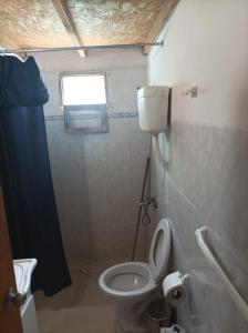 Ένα μπάνιο στο Apartamento de sol a sol