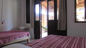 Un pat sau paturi într-o cameră la La Casa Del Profe Salo